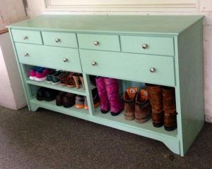 Old dresser painted and turned into a shoe rack and hat and mitten
