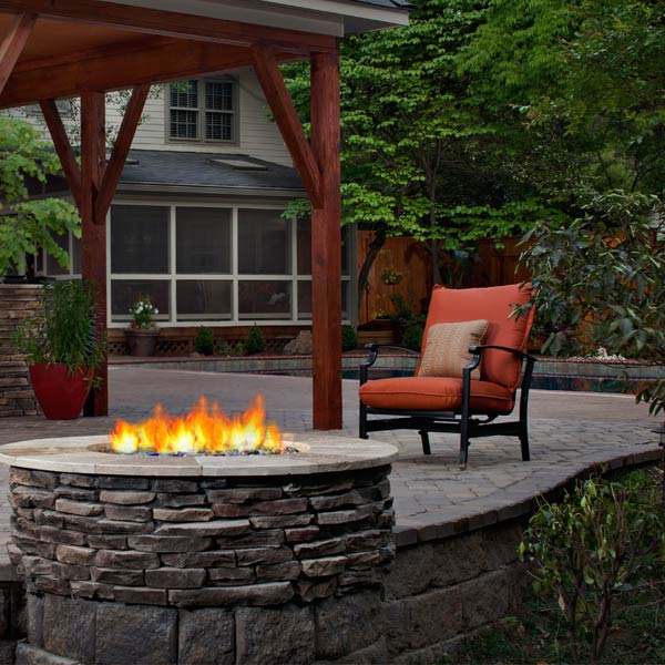 Natural Stone Fire Pit Warms Charlotte Patio | Archadeck Outdoor Living
