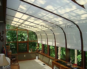 Screen shades in curved Four Seasons sunroom. | Sunroom Shades in