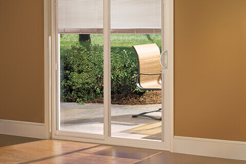 The advantages of sliding doors with built in blinds - Pella Branch