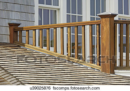 Stock Images of Wooden balcony railing and shingled roof u39025876
