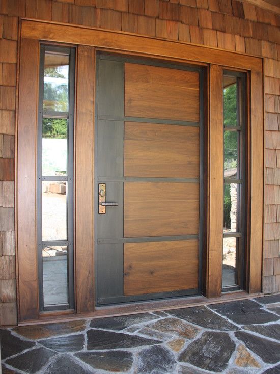 Contemporary front door of stained wood and rolled steel | Home