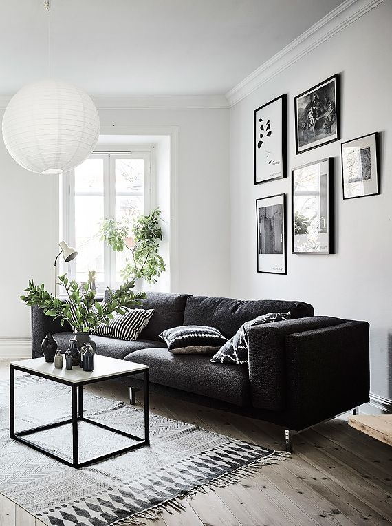Living room in black, white and gray with nice Gallery wall