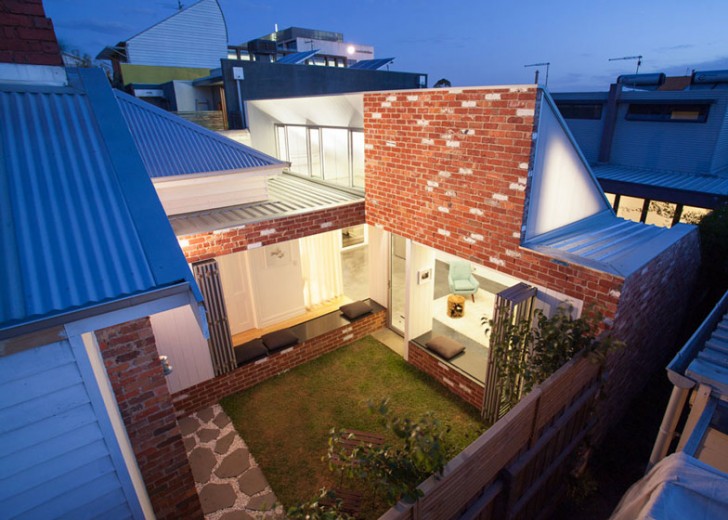 Architects 'Turn Around' an Aging Victorian Home to Flood it With