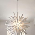 Home lighting with a modern white chandelier