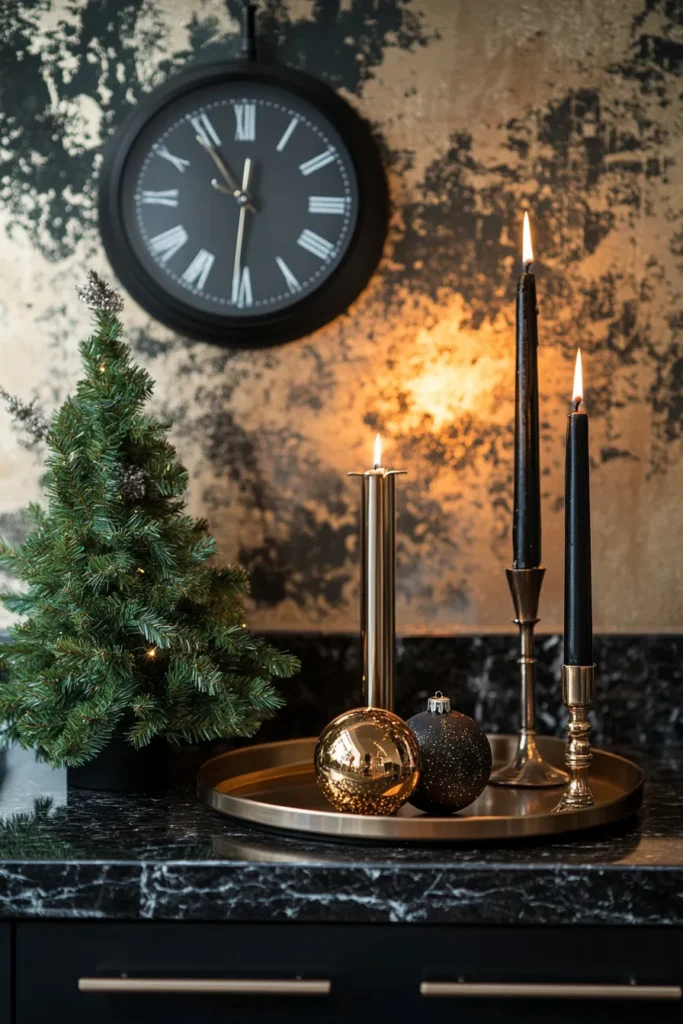 Sophisticated black and gold Christmas table vignette with marble surface and gold accents
