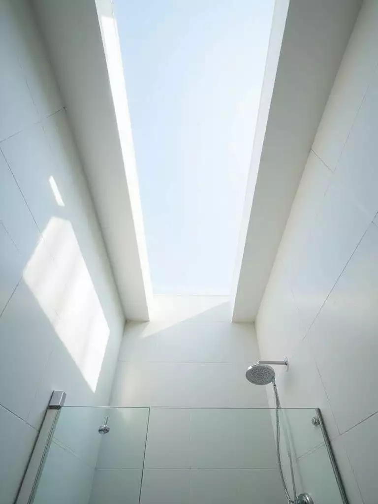 Bathroom shower with skylight providing natural light