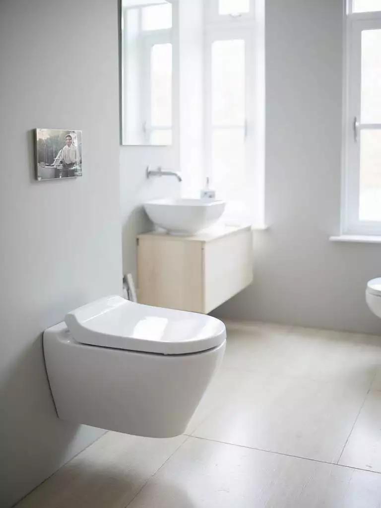 Modern bathroom with integrated bidet toilet seat, showcasing hygiene and convenience.