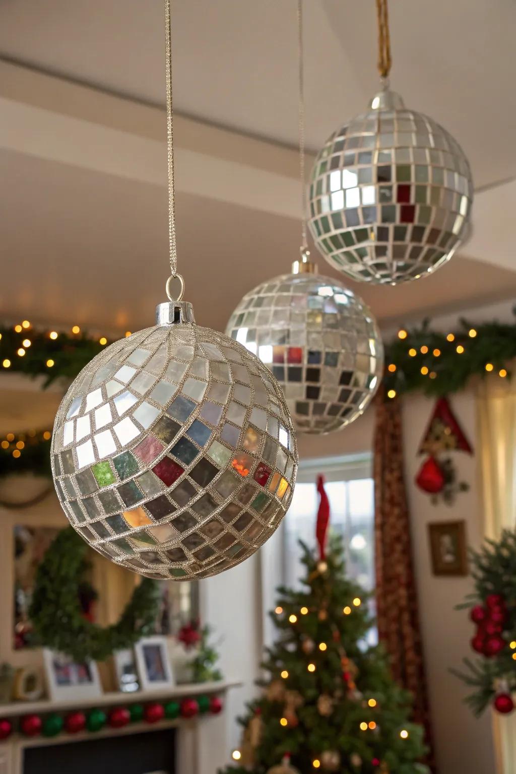 Hanging ornaments made from mirror shards catching light.