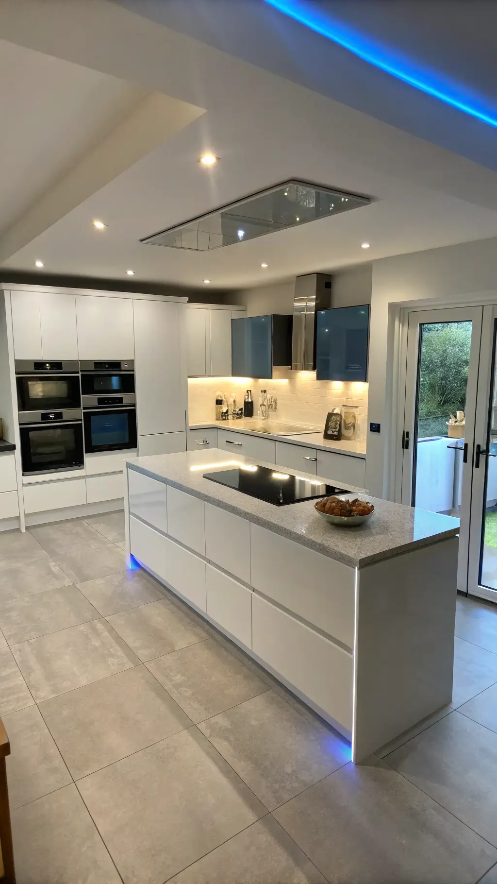 High-gloss white push-to-open handleless cabinets in modern kitchen