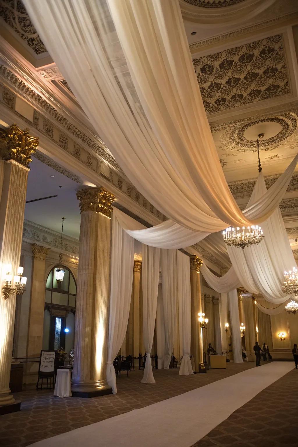 Elegant ceiling drapery adds a luxurious feel to the venue.