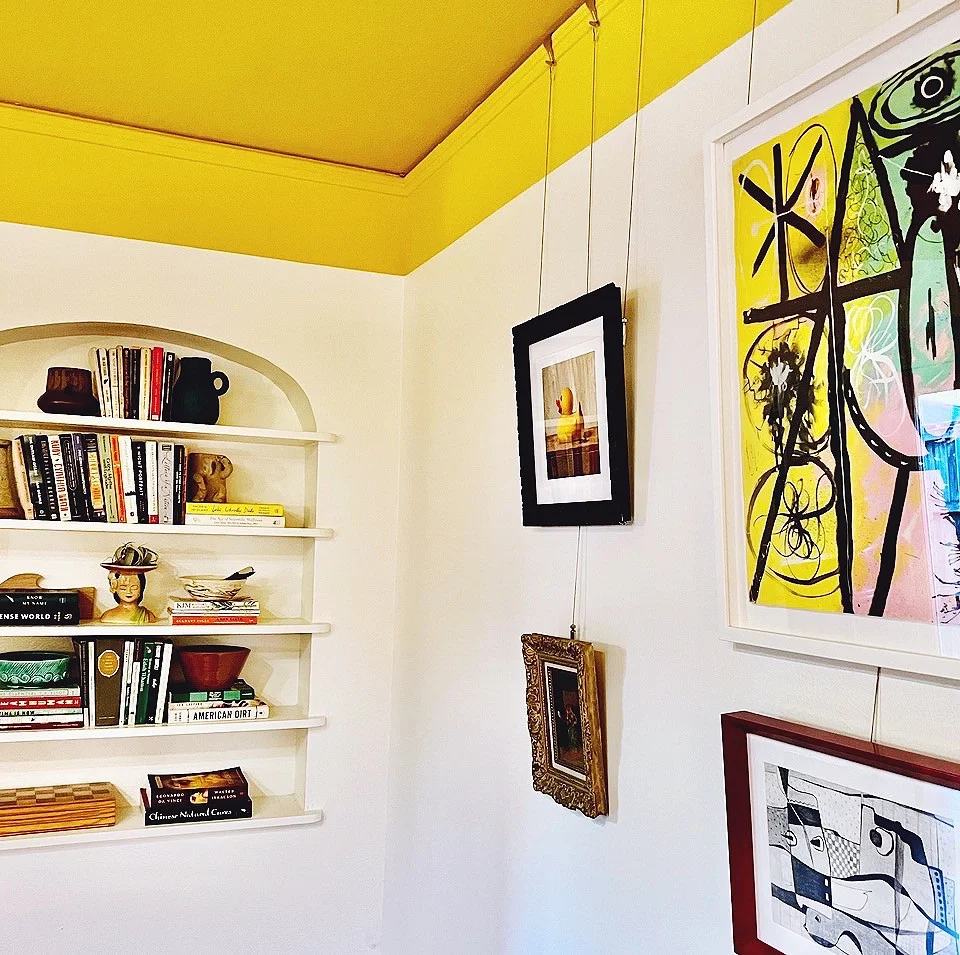 Bright yellow painted ceiling in room