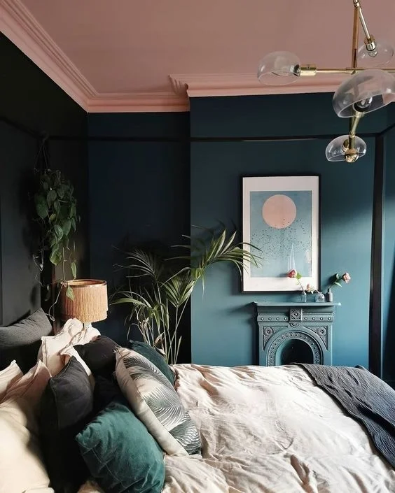 Teal walls with soft pink ceiling in bedroom