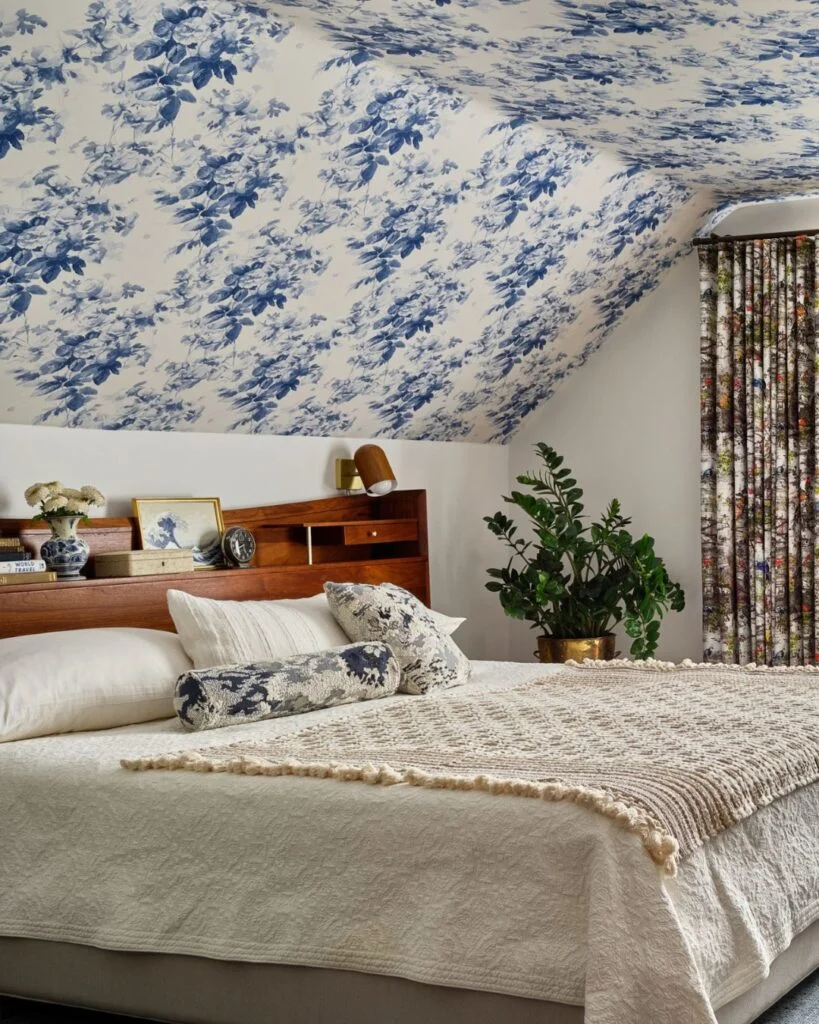 Blue floral painted ceiling in bedroom