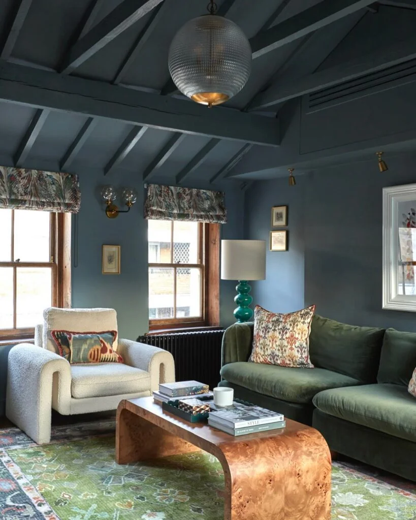 Deep navy beamed ceiling in living room
